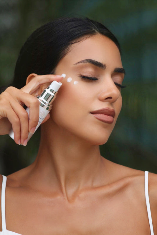 Woman Applying Joieuse Hyaluronic Acid  Cream to Face