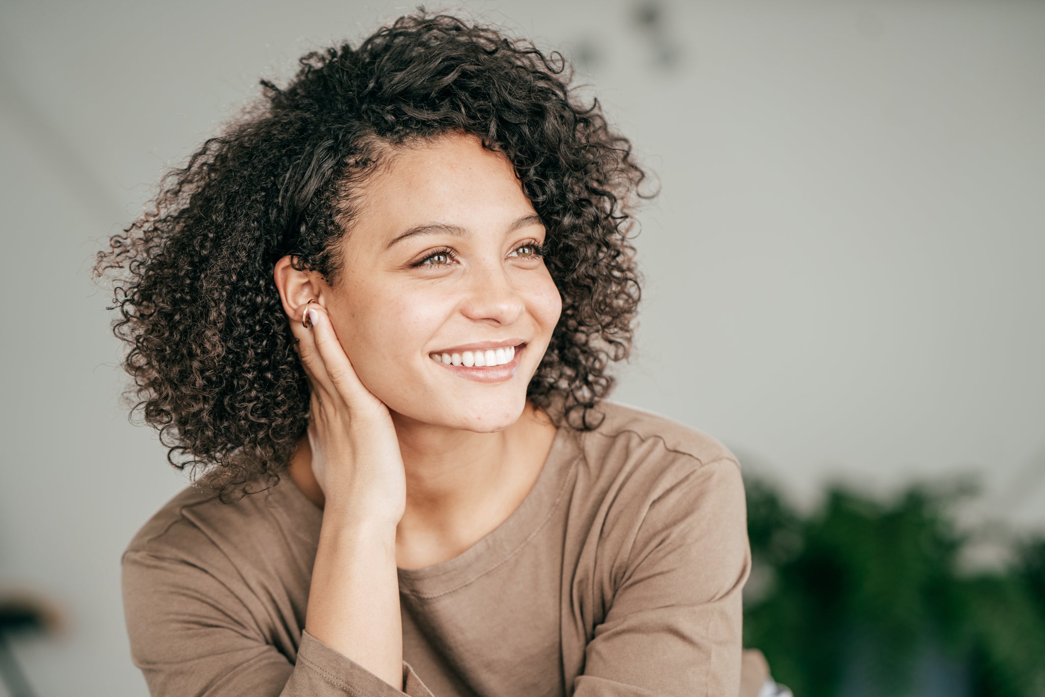 Woman smiling after using alpha arbutin